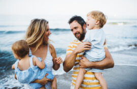 Young Family On Beach