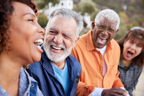 Older people laughing outside