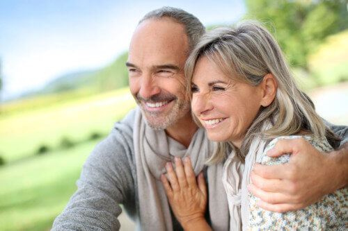 Happy older couple outside