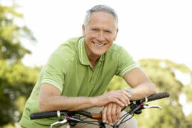 Man leaning on bike