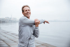 Man walking outside by the water