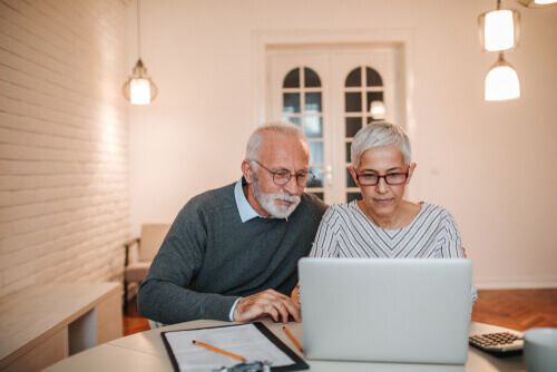 older couple working on a laptop computer