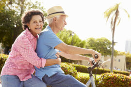 Older couple on a bike