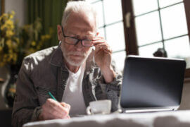 Older man on a computer