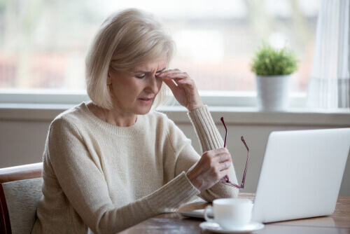 Older woman rubbing her eyes