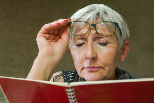 woman trying to read