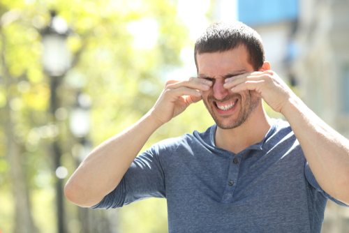 Man rubbing his eyes